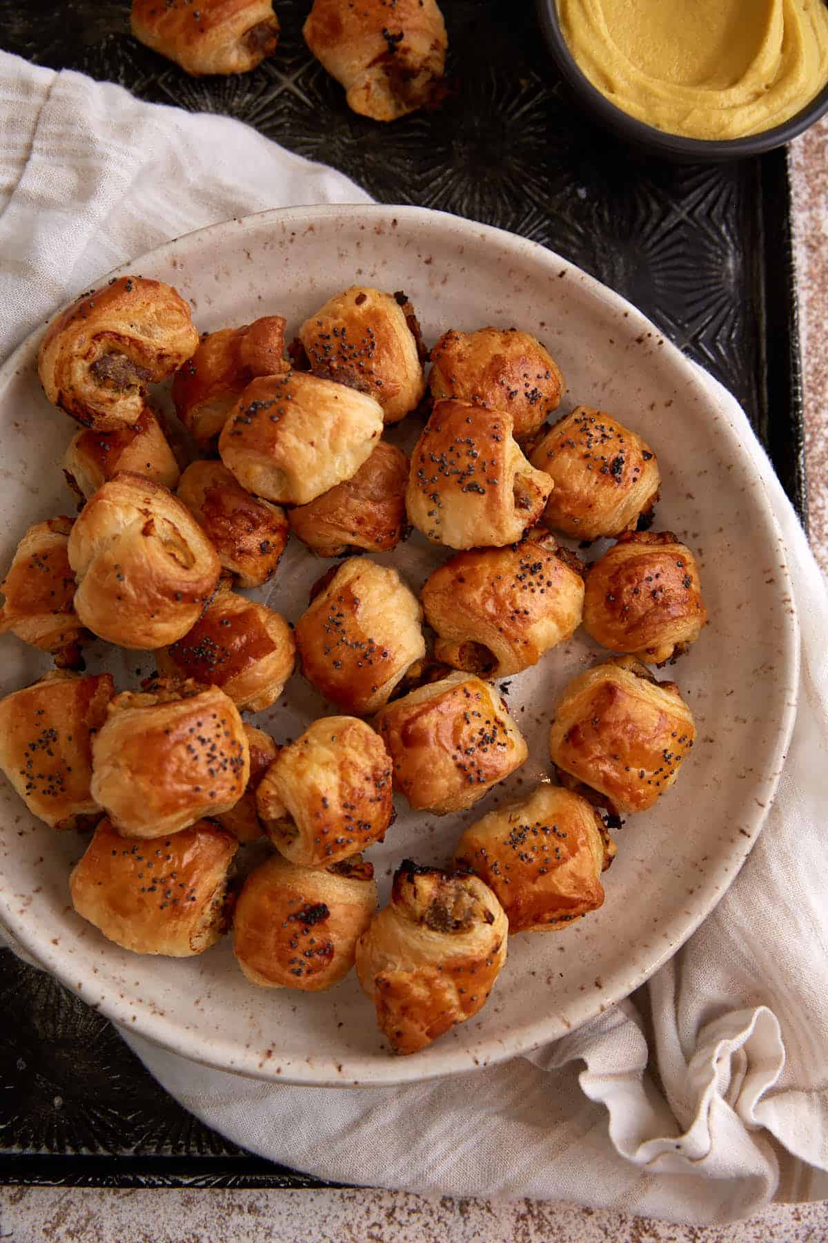A platter of apple sausage rolls. 