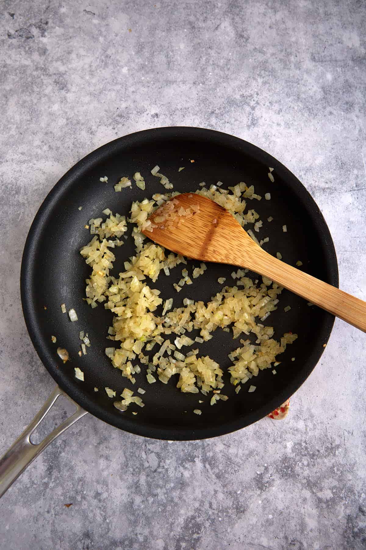 Onions cooking in a skillet.