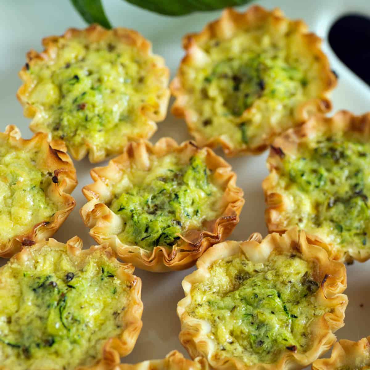 Bursting with Flavor Mini Zucchini Quiches in Phyllo Dough - Butter ...