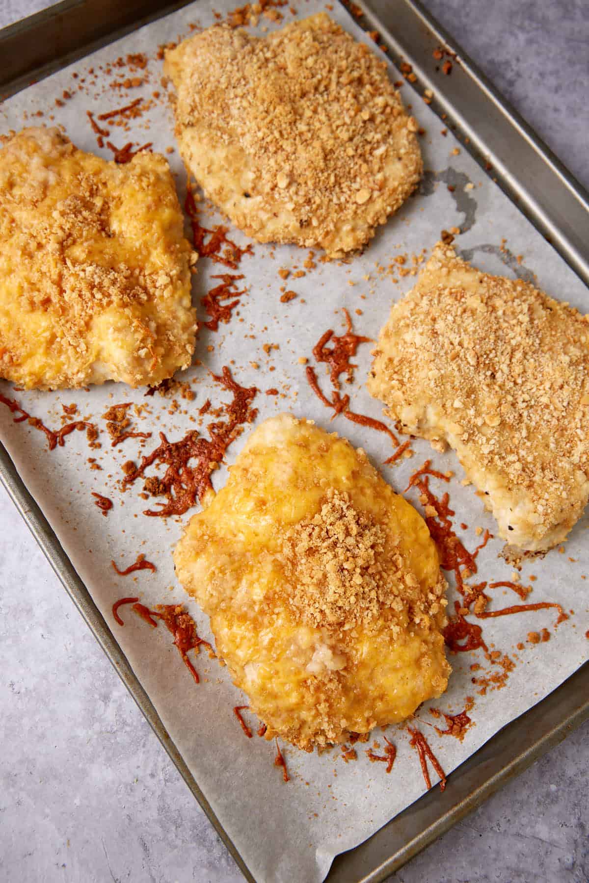 Baked crispy Ritz chicken on a baking sheet.