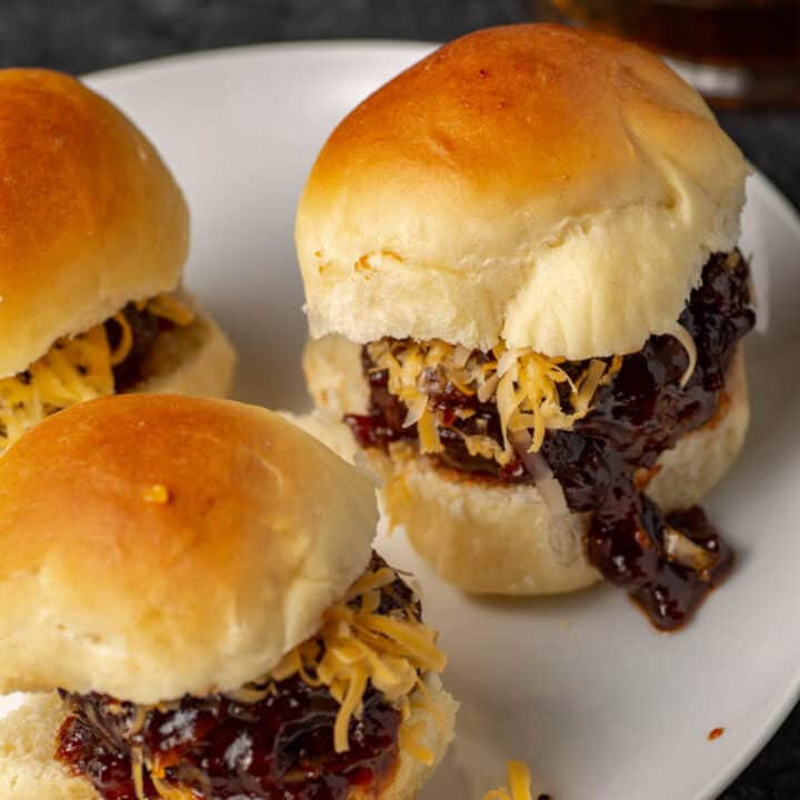 Barbecue hamburger sliders on a platter.