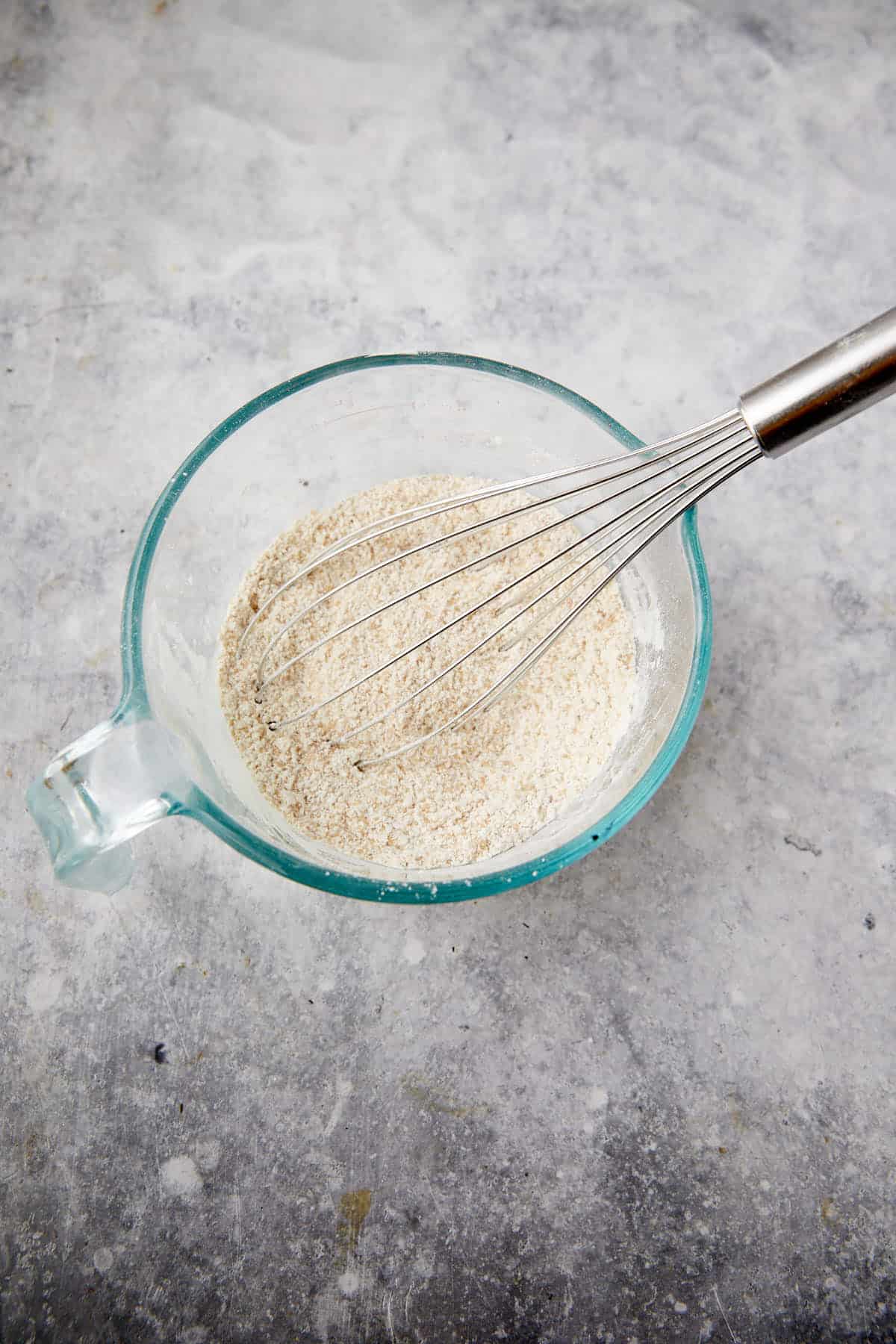 Flour, cornstarch and sugar in a bowl with a whisk.