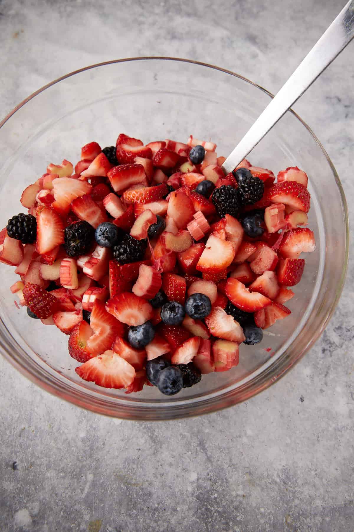 Mixed berries and rhubarb in a bowl.