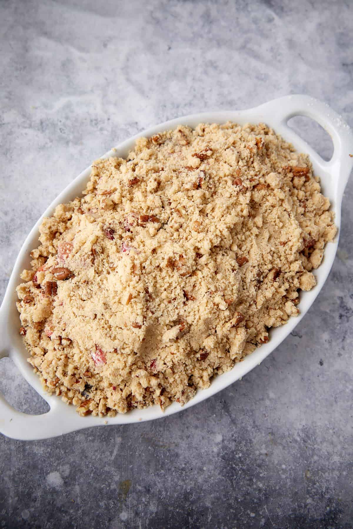 Streusel on the top of a rhubarb berry crisp.