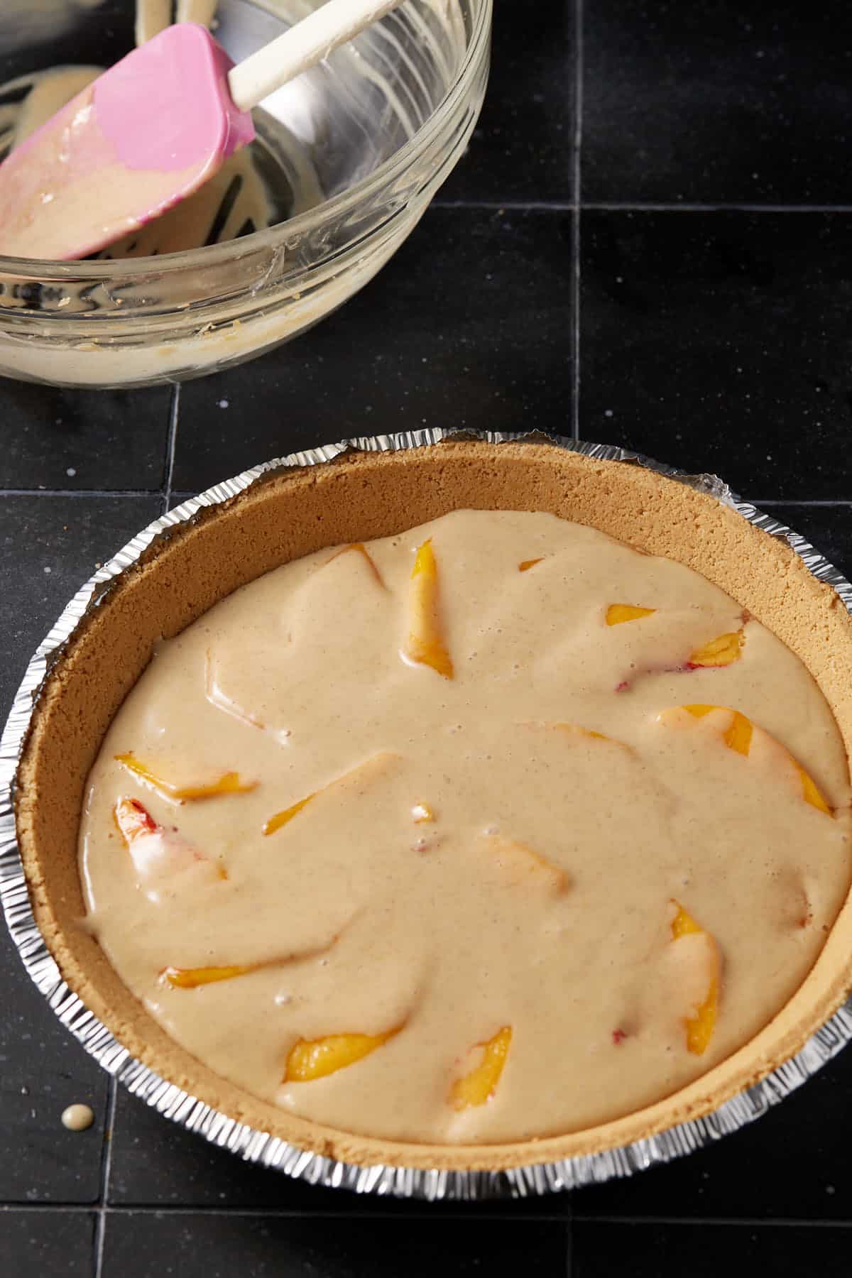 Peach slices covered in custard.