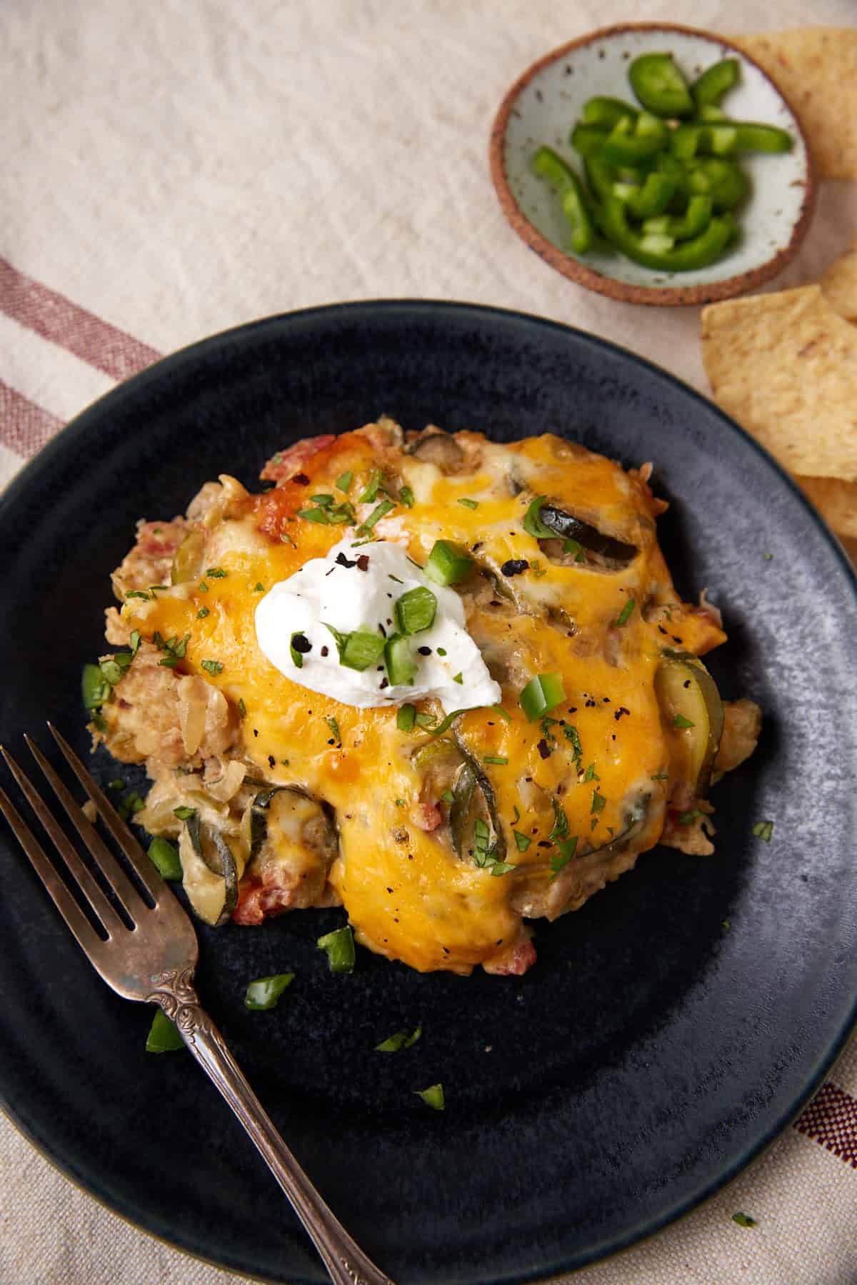 Tex mex squash casserole on a serving plate.