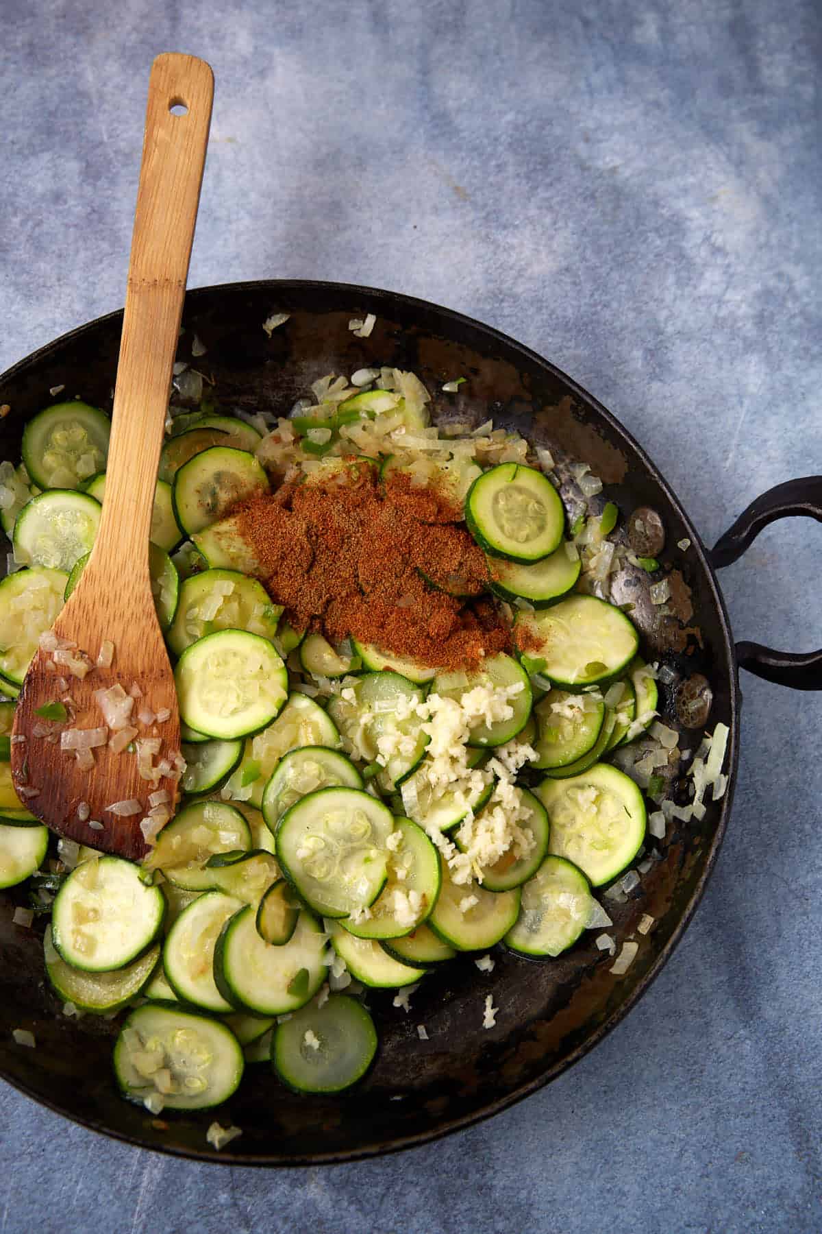 Seasonings added to the cooked squash and onions.