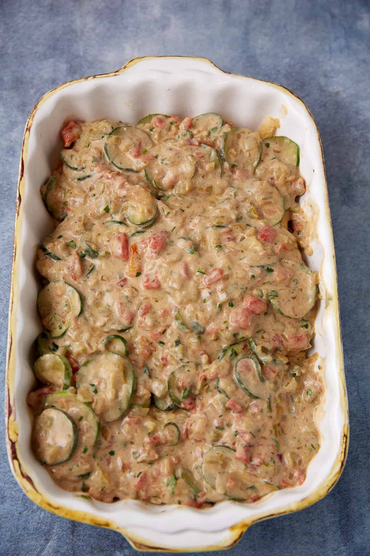 The squash layer added to the tortilla chip layer.