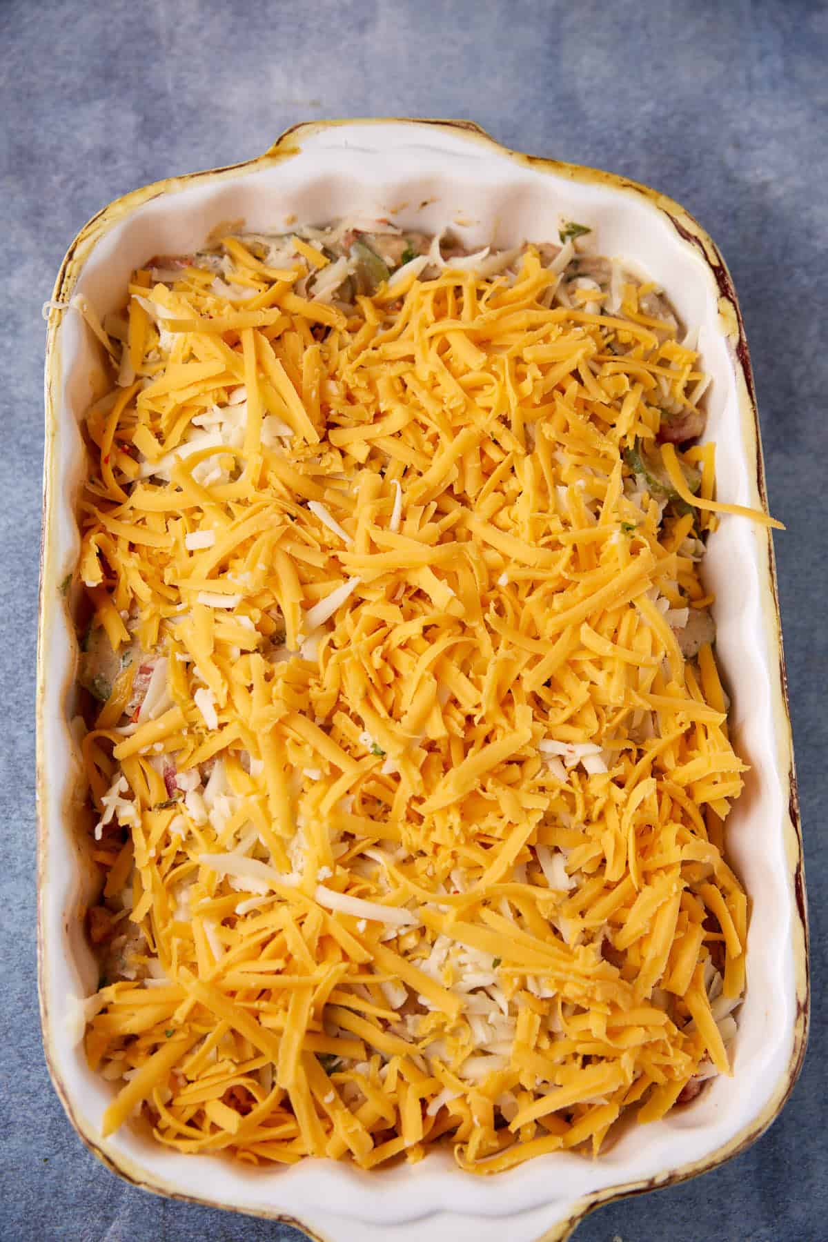A layer of cheese on top of the squash casserole.