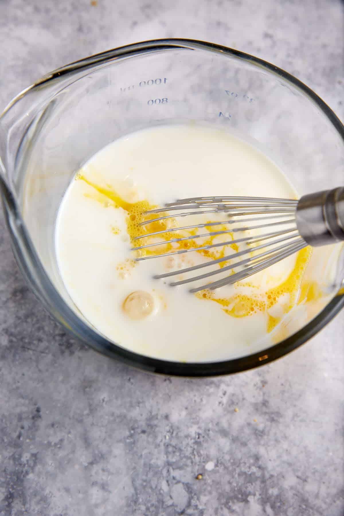 Buttermilk and eggs in a bowl.