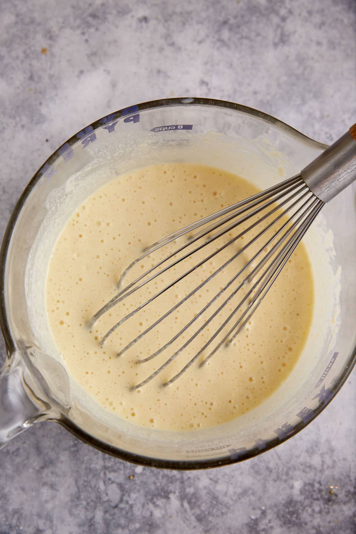 Cornmeal muffin batter in a mixing bowl.