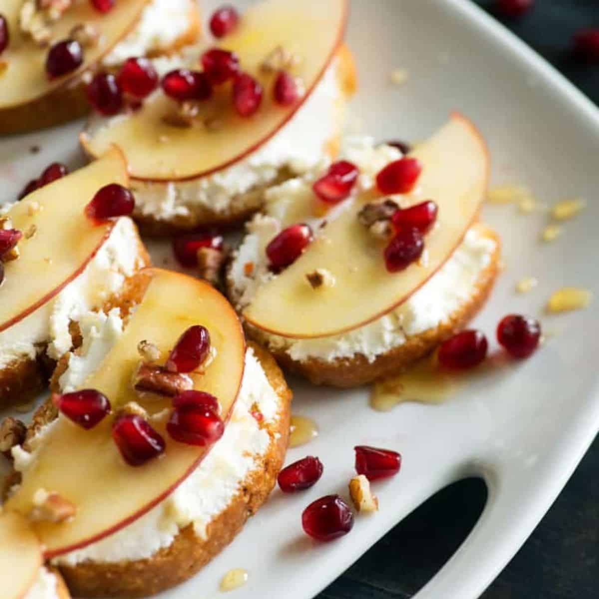 A platter of pomegranate crostini.