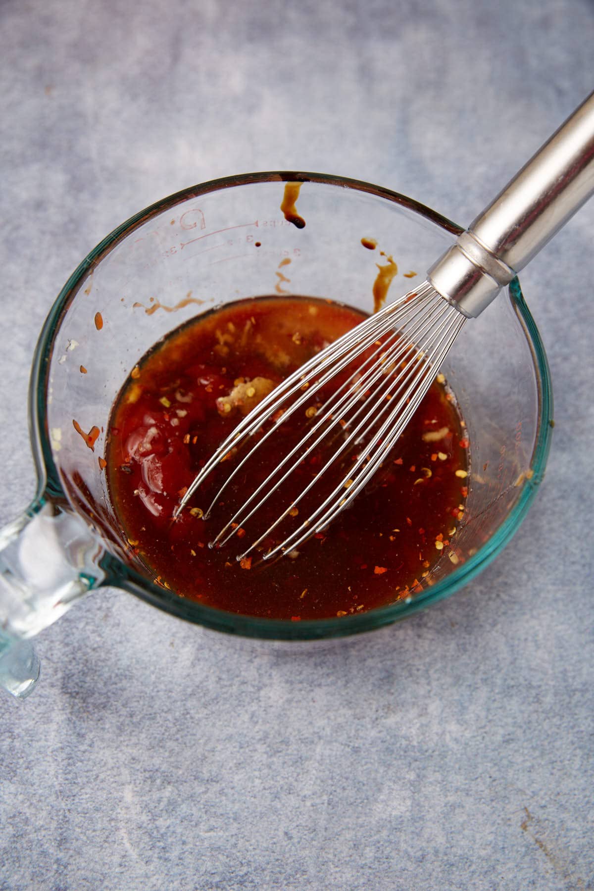 BBQ sauce for pulled chicken in a measuring cup.