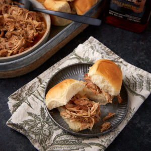 A bourbon chicken sandwich on a plate.