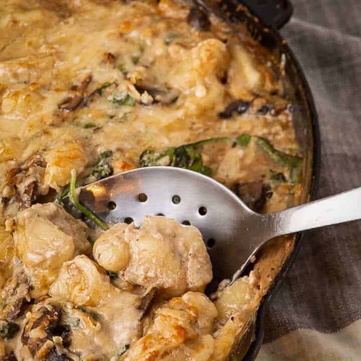 An iron skillet with baked gnocchi