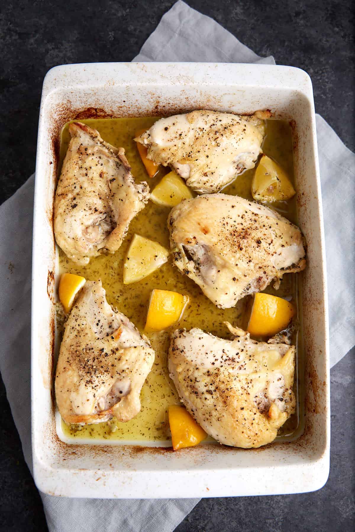 Baked chicken breasts in a baking dish.