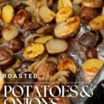 Oven roasted potatoes and onions on a sheet pan.