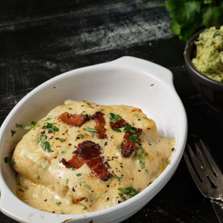A baked hot brown with a side of guacomole.