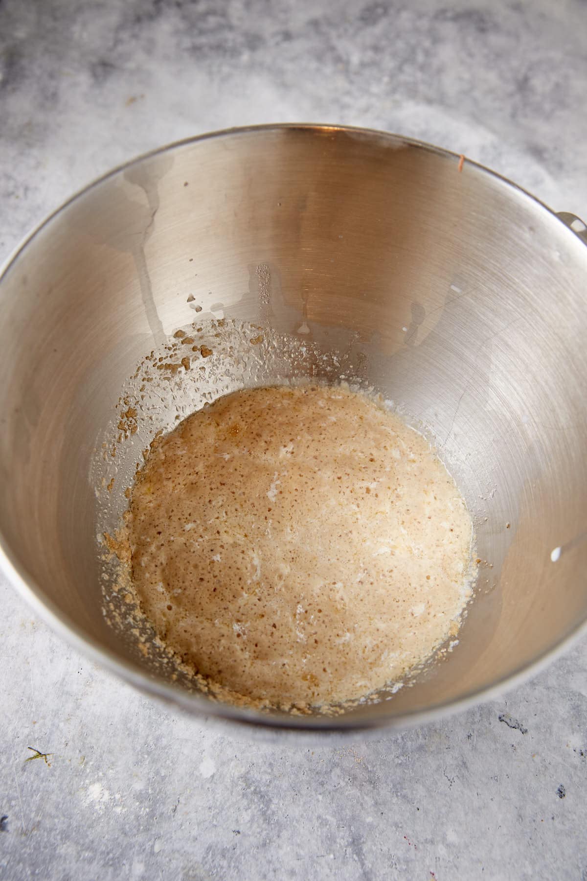 Bratwurst sausages are first grilled and then wrapped in a homemade pretzel dough. Boiled and then baked to get that perfect pretzel texture. It takes a couple of steps but it's so worth it when you bite into a juicy bratwurst and get the best pretzel dough in each bite. It's a grown up version of pigs-in-a-blanket.