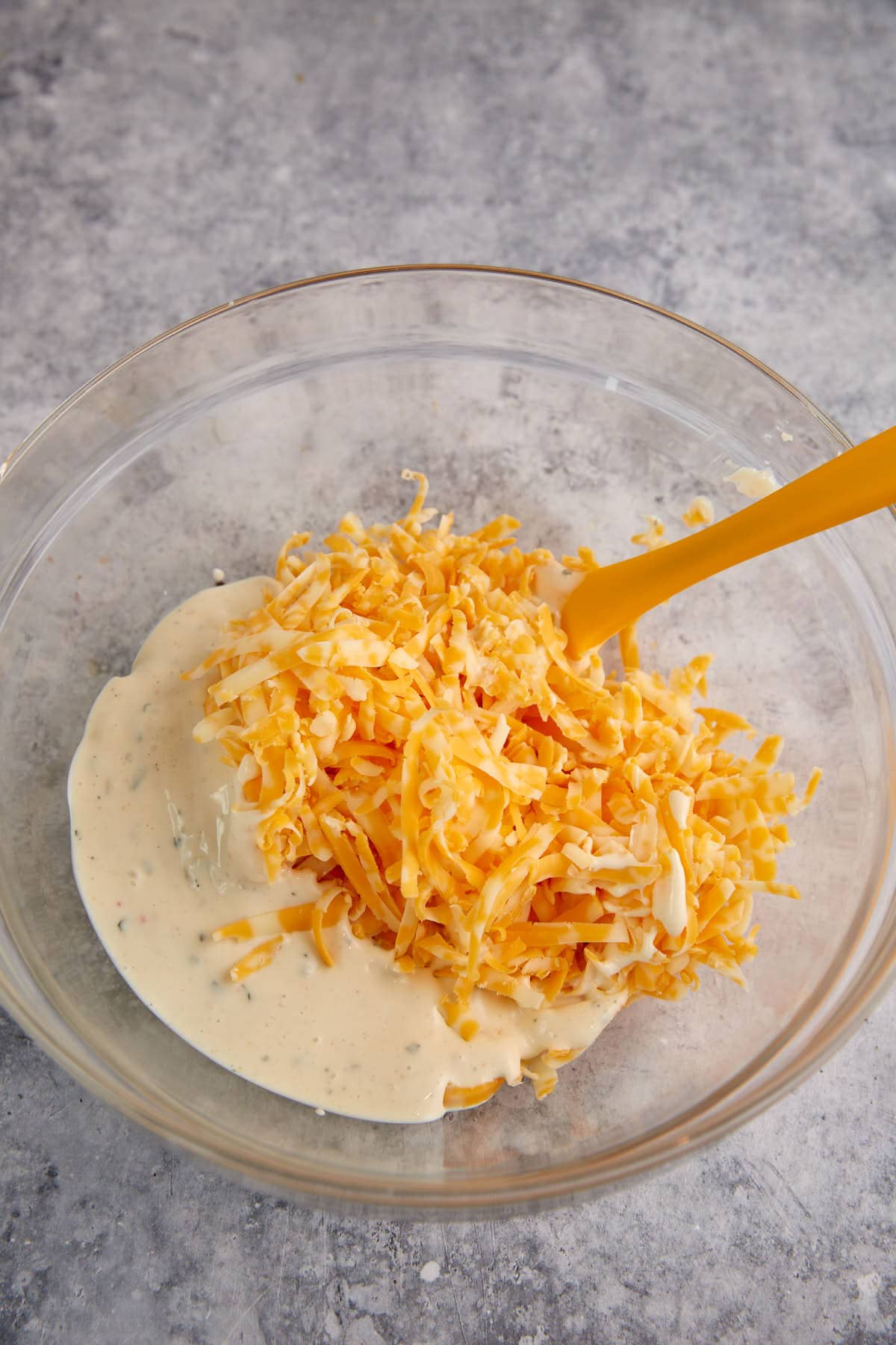 Cheese and ranch dressing in a bowl.