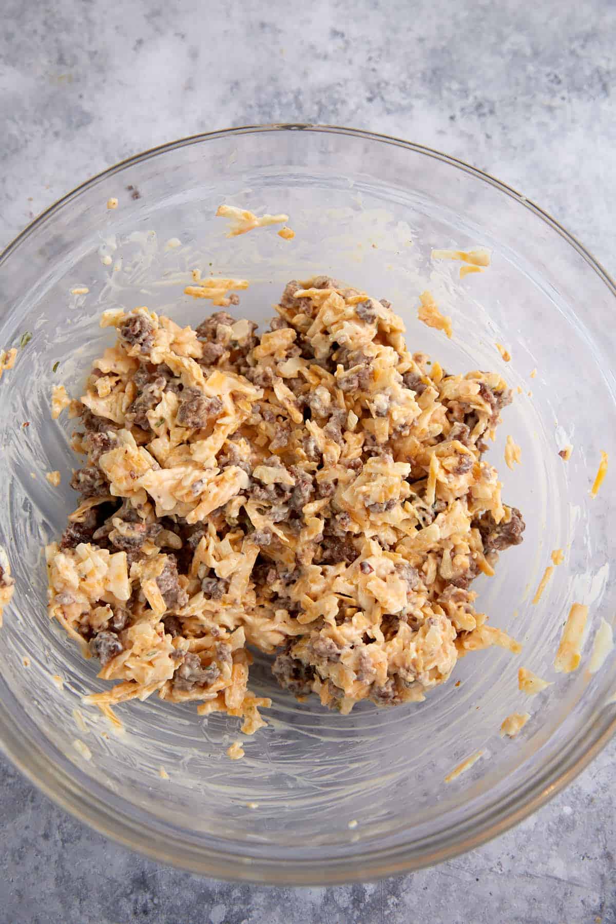 Cooked sausage added to the cheese and dressing.