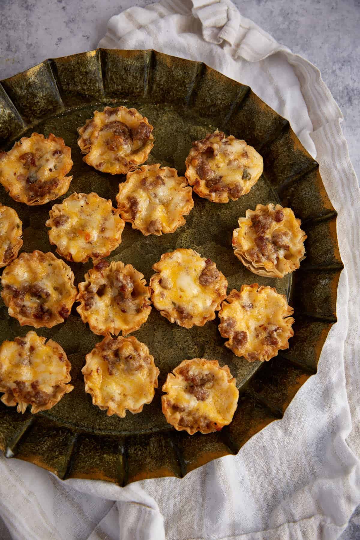 A platter of sausage cups.