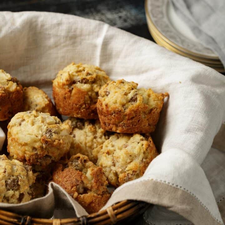 Sausage biscuits in a basket.