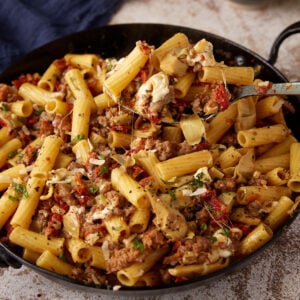 Sun-Dried pasta with artichokes in a skillet.
