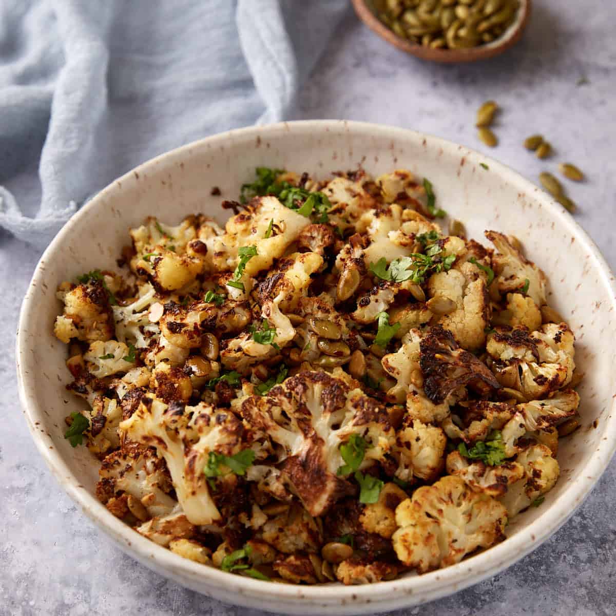 Roasted cauliflower with brown butter in a serving bowl.