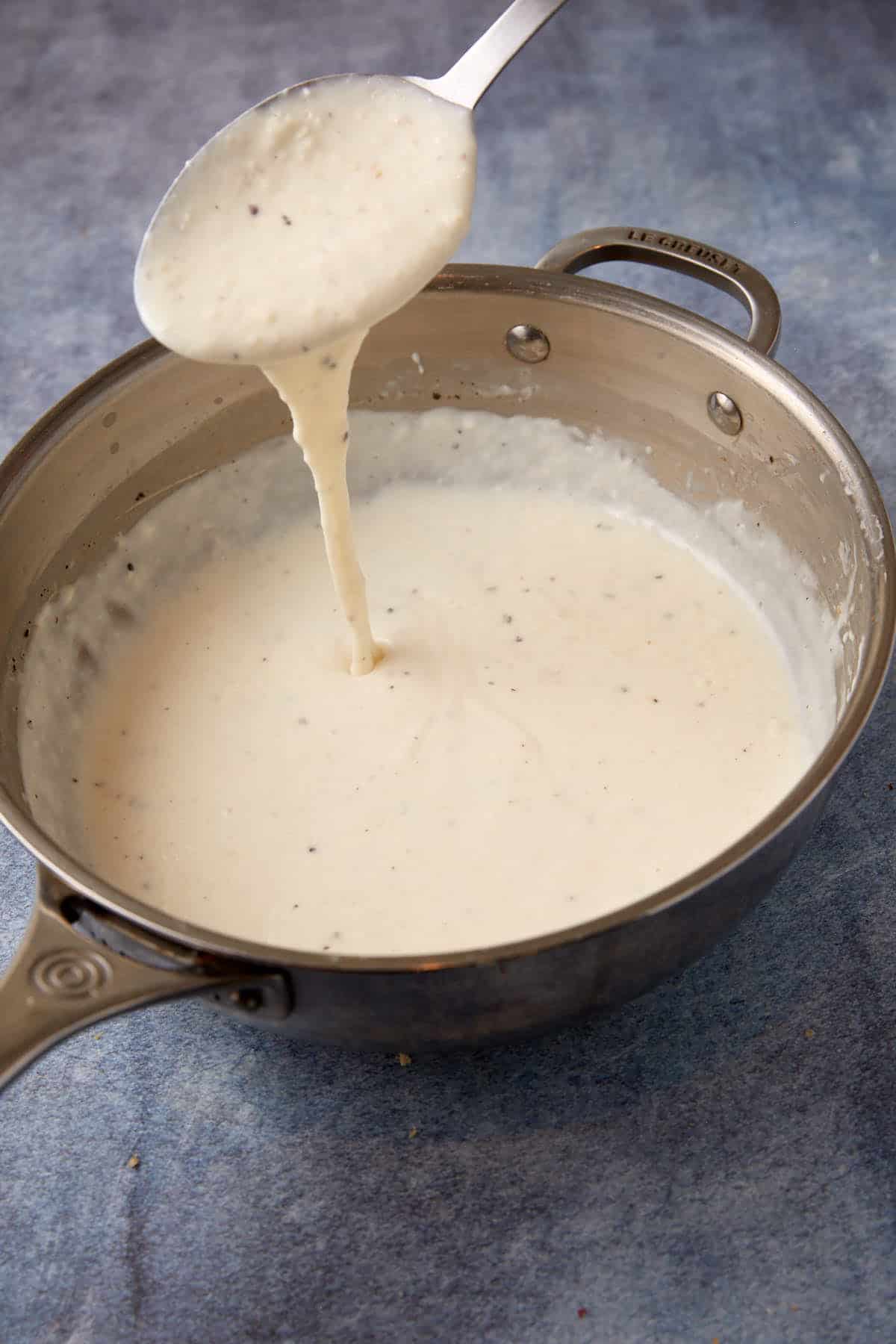 A bechamel sauce that has thickend in a saucepan.