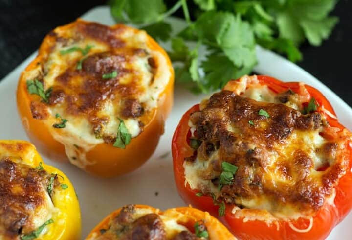 Southwestern stuffed peppers on a platter with cilantro