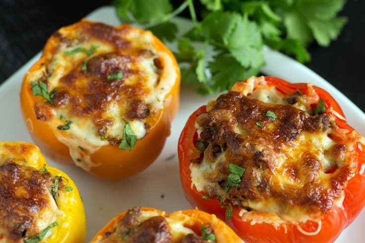 Southwestern stuffed peppers on a platter with cilantro