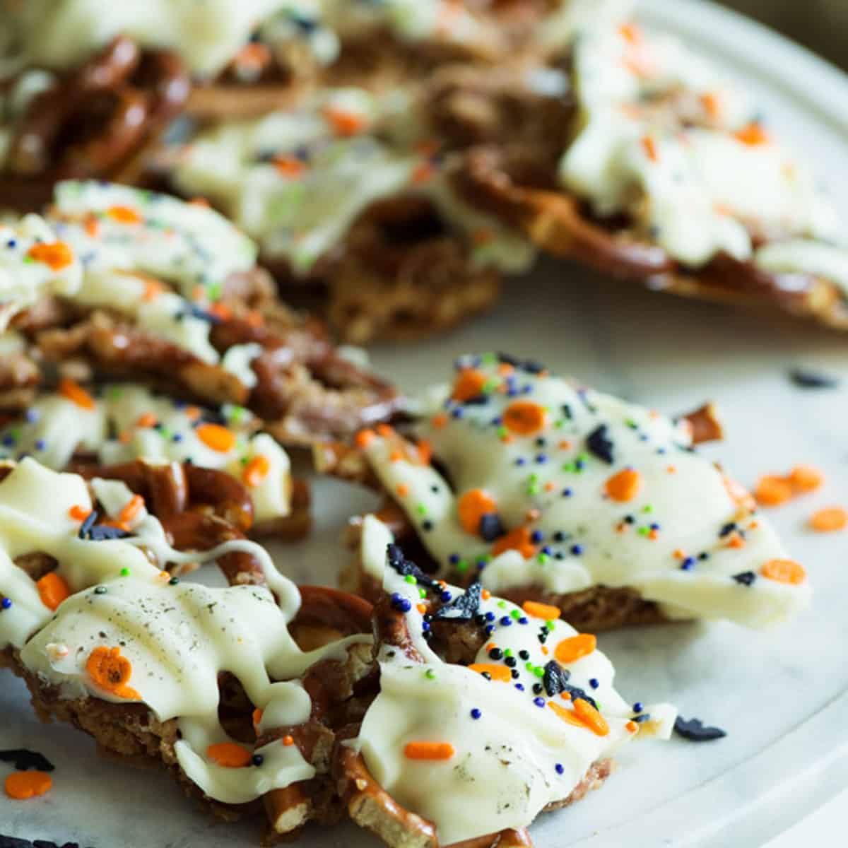 White chocolate with Halloween sprinkles over pretzels.