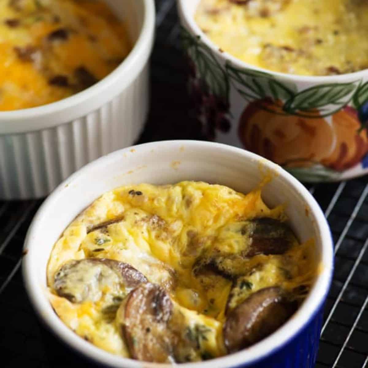 Ceramic cups of baked eggs.