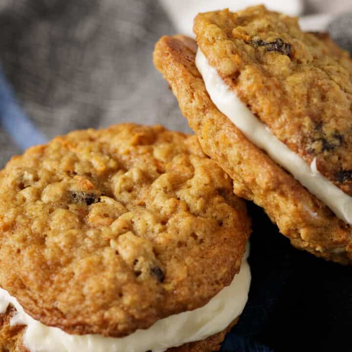 Cream cheese filled carrot cake cookies propped next to each other