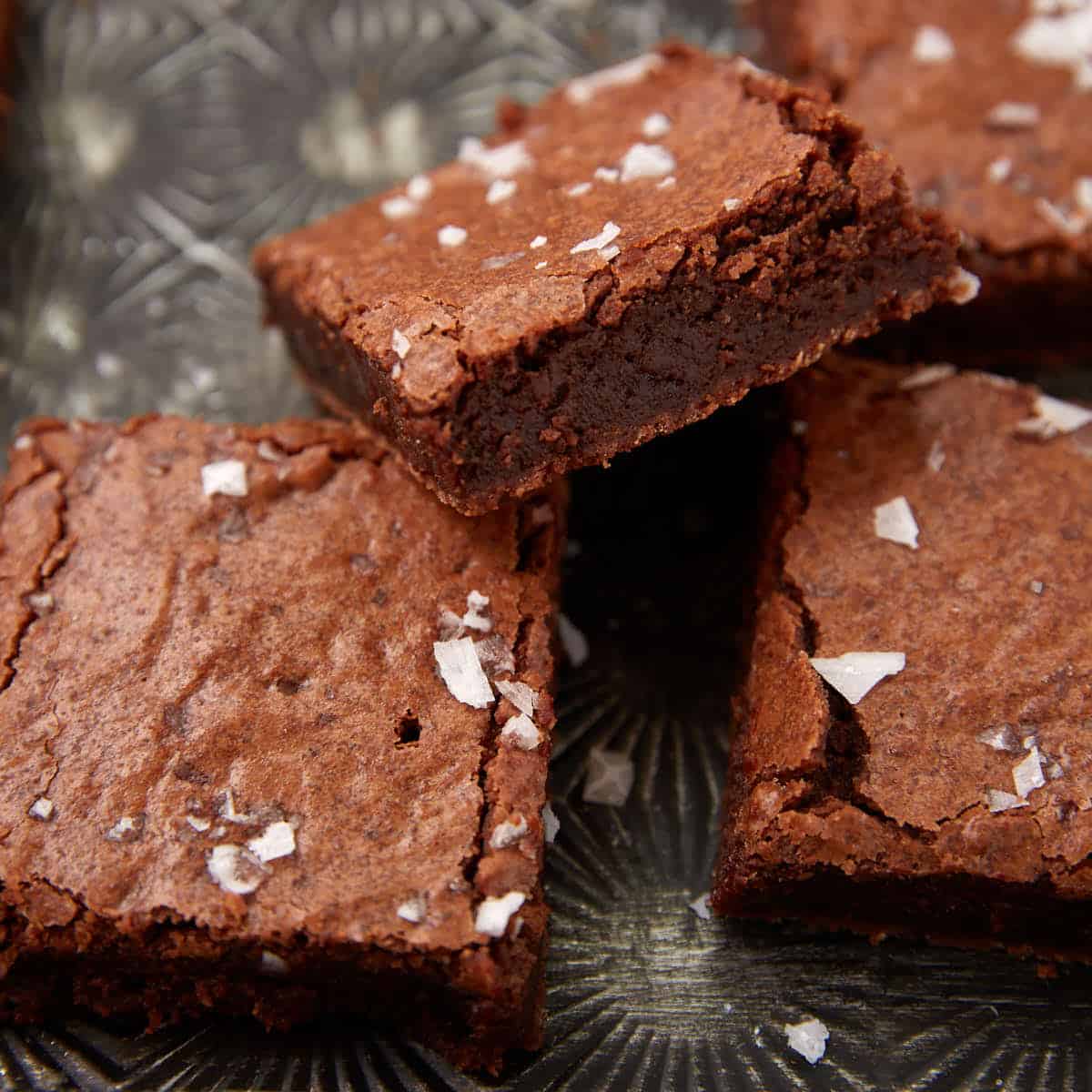 Fudgy brownies on a baking sheet.