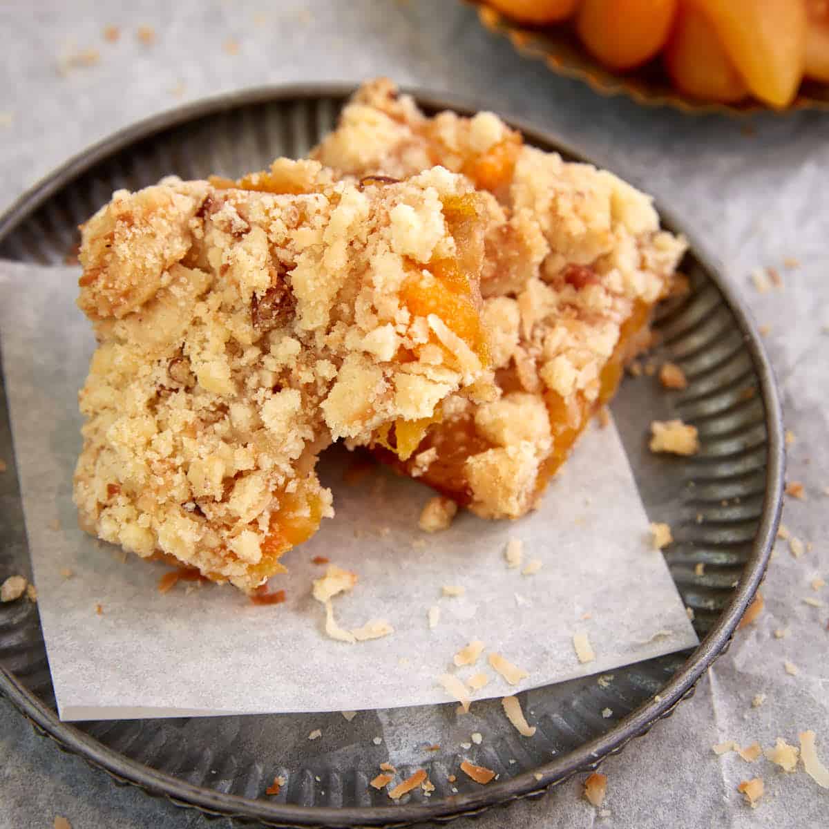 An apricot bar with a bite taken out.
