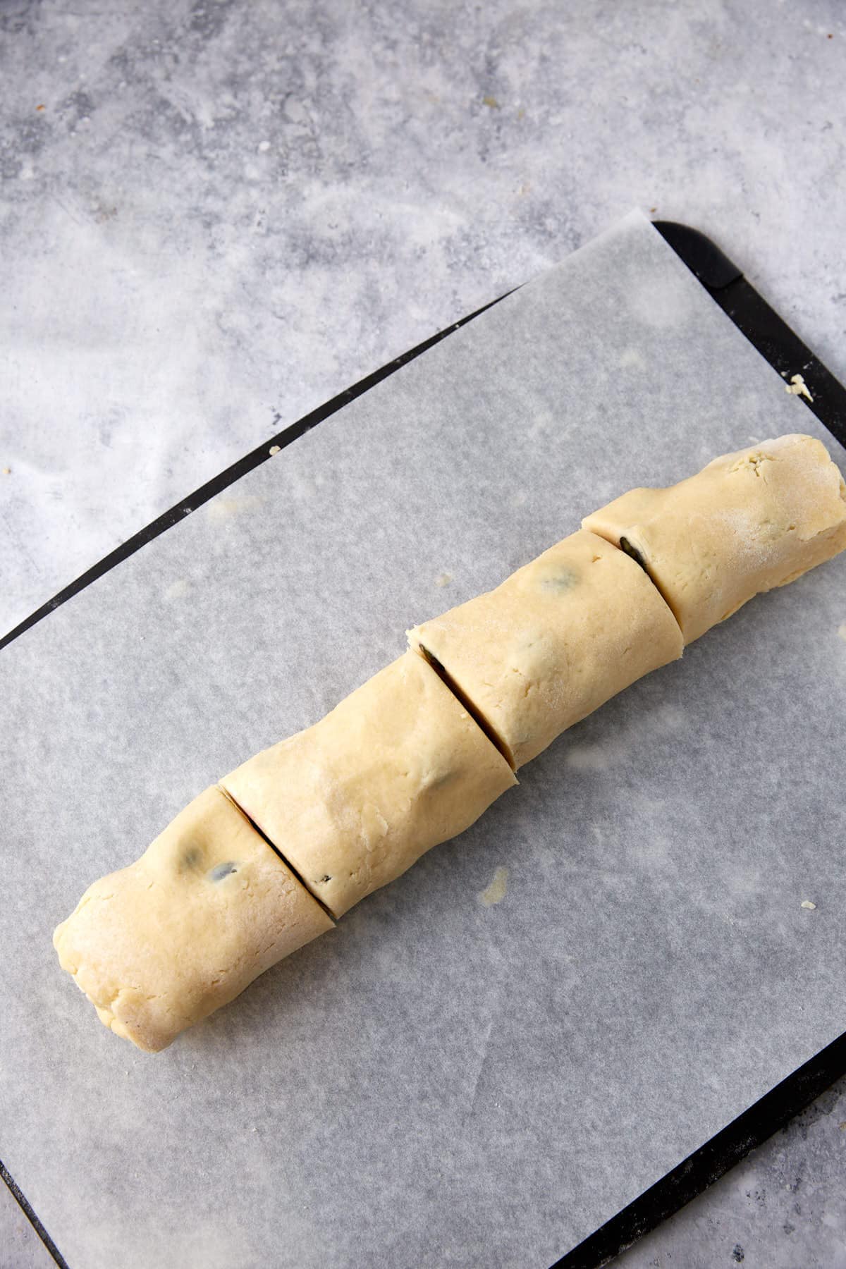 A roll of blueberry scone dough.