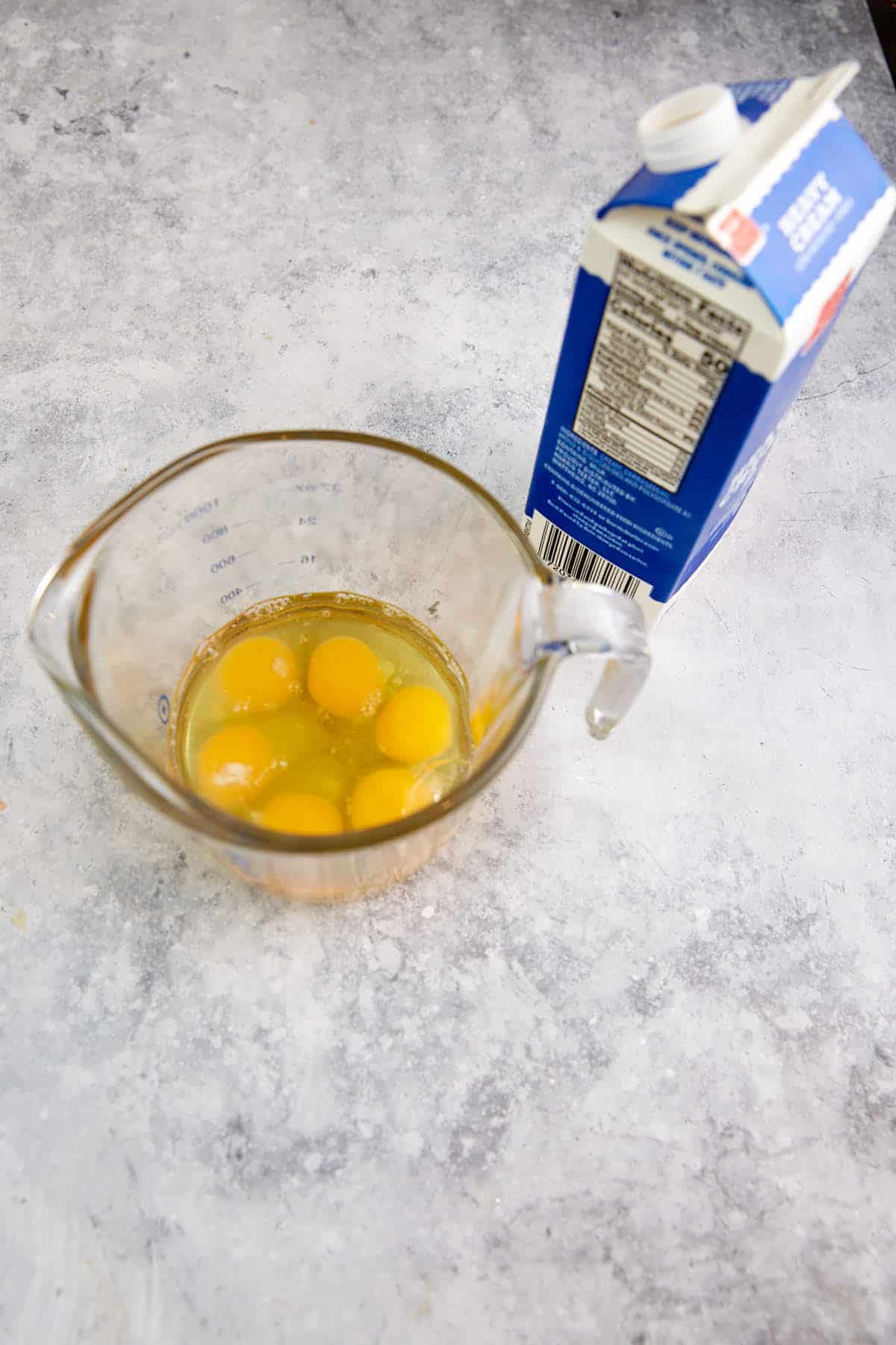 Eggs in a measuring bowl.