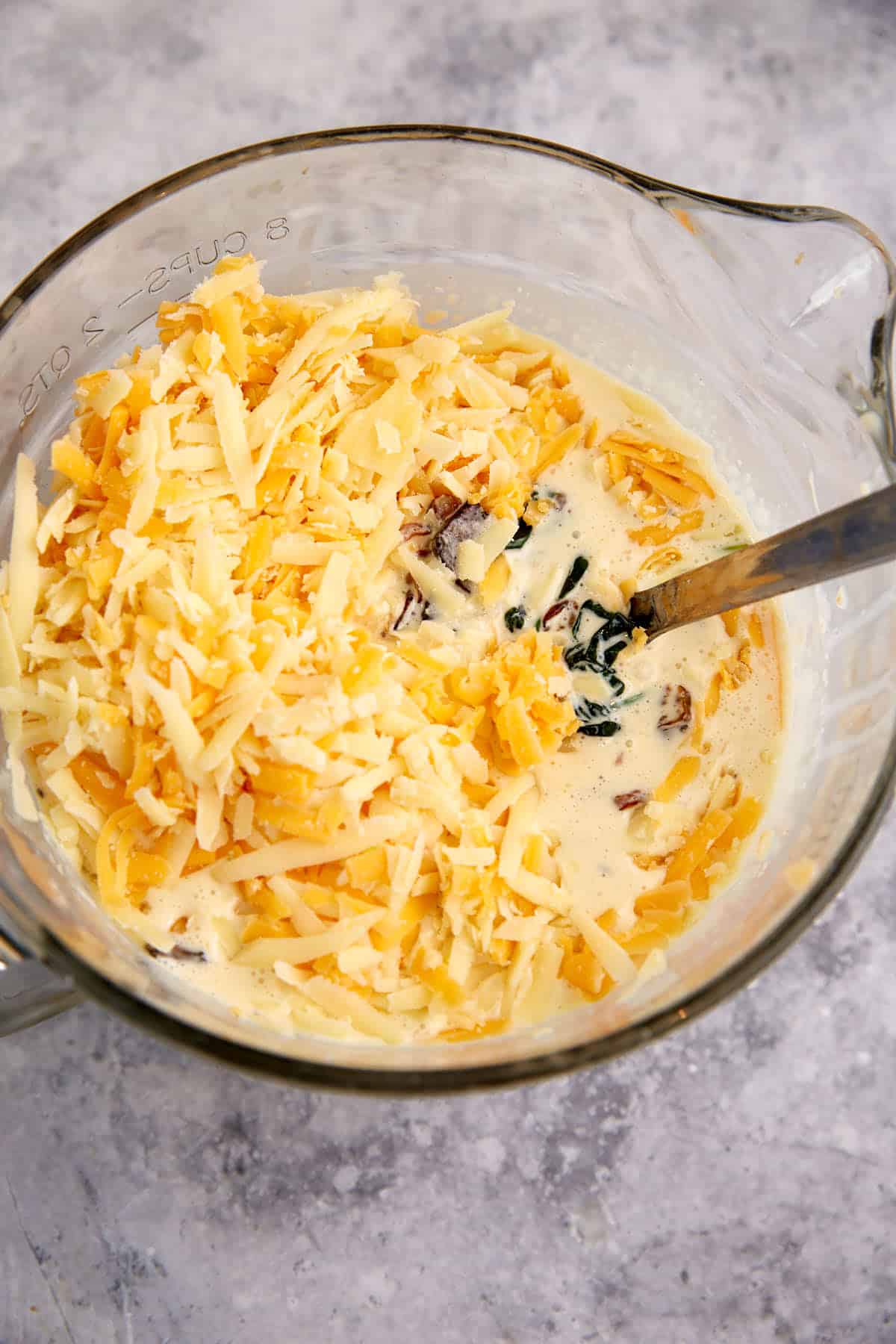 Cheese added to the egg mixture.