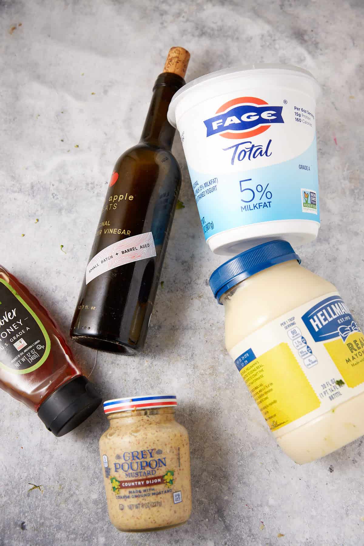 The ingredients for a honey yogurt dressing.