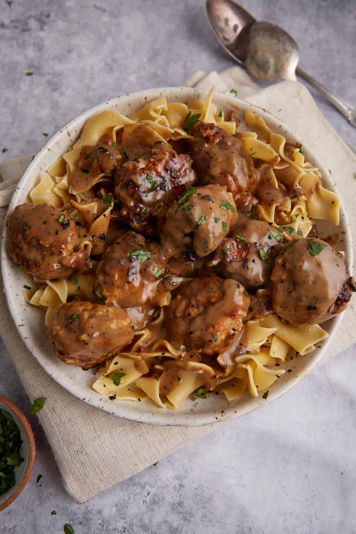 A platter of chicken meatballs in Marsala sauce.