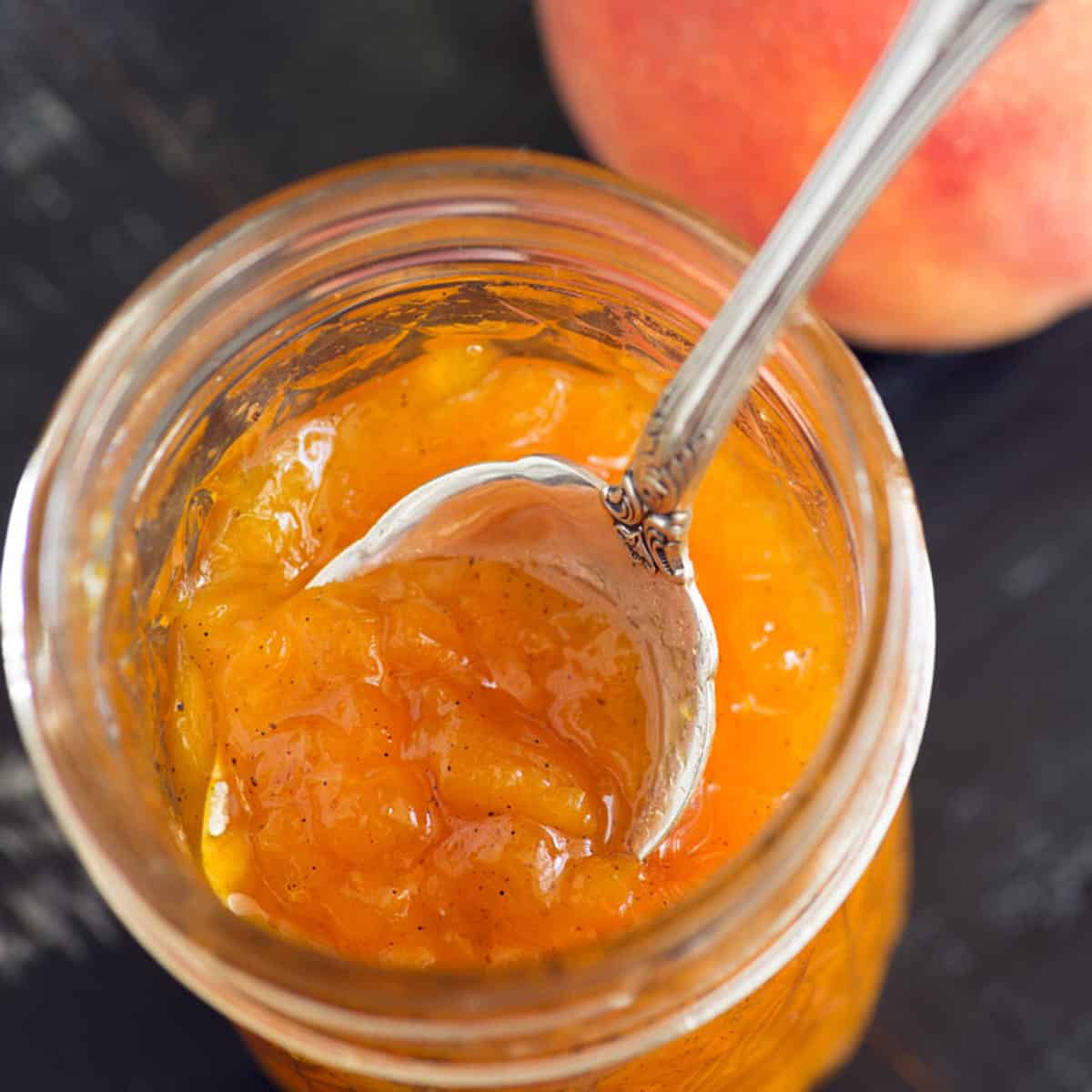 A spoonful of homemade peach jam.