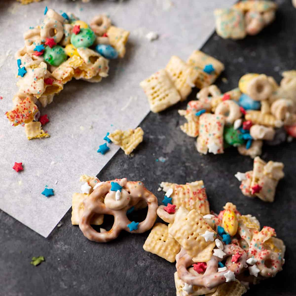 White chocolate Chex mix on parchment paper.