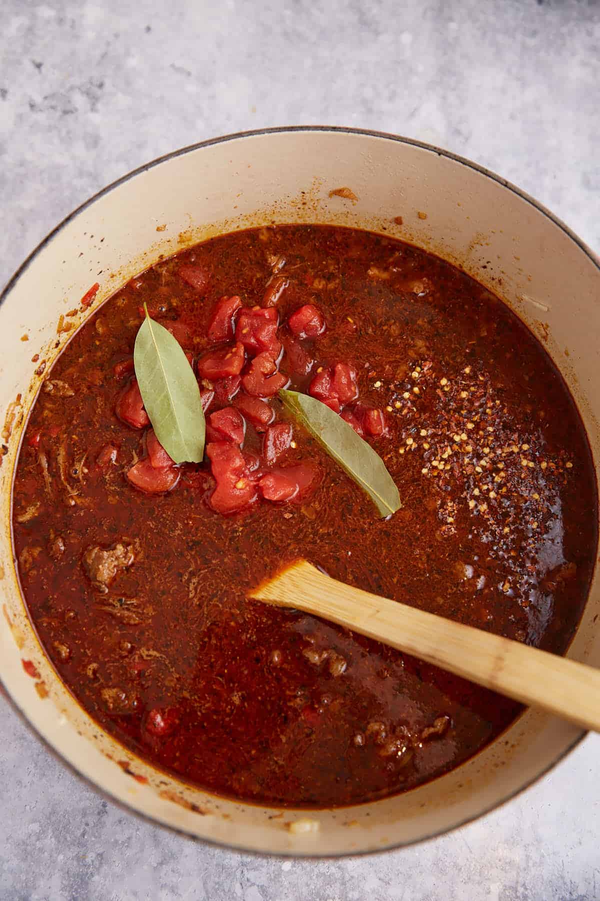 A pot of chili before it has simmered.