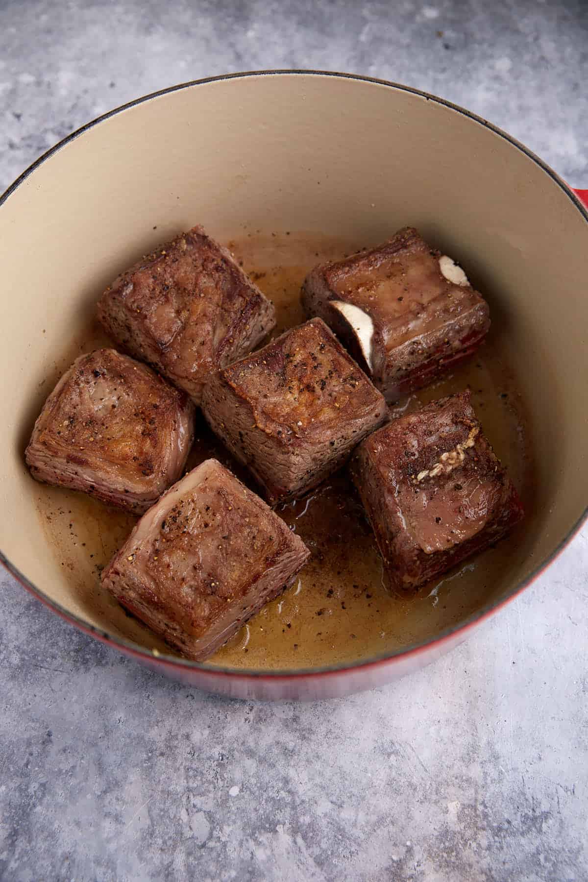 Bowned short ribs in a Dutch oven.