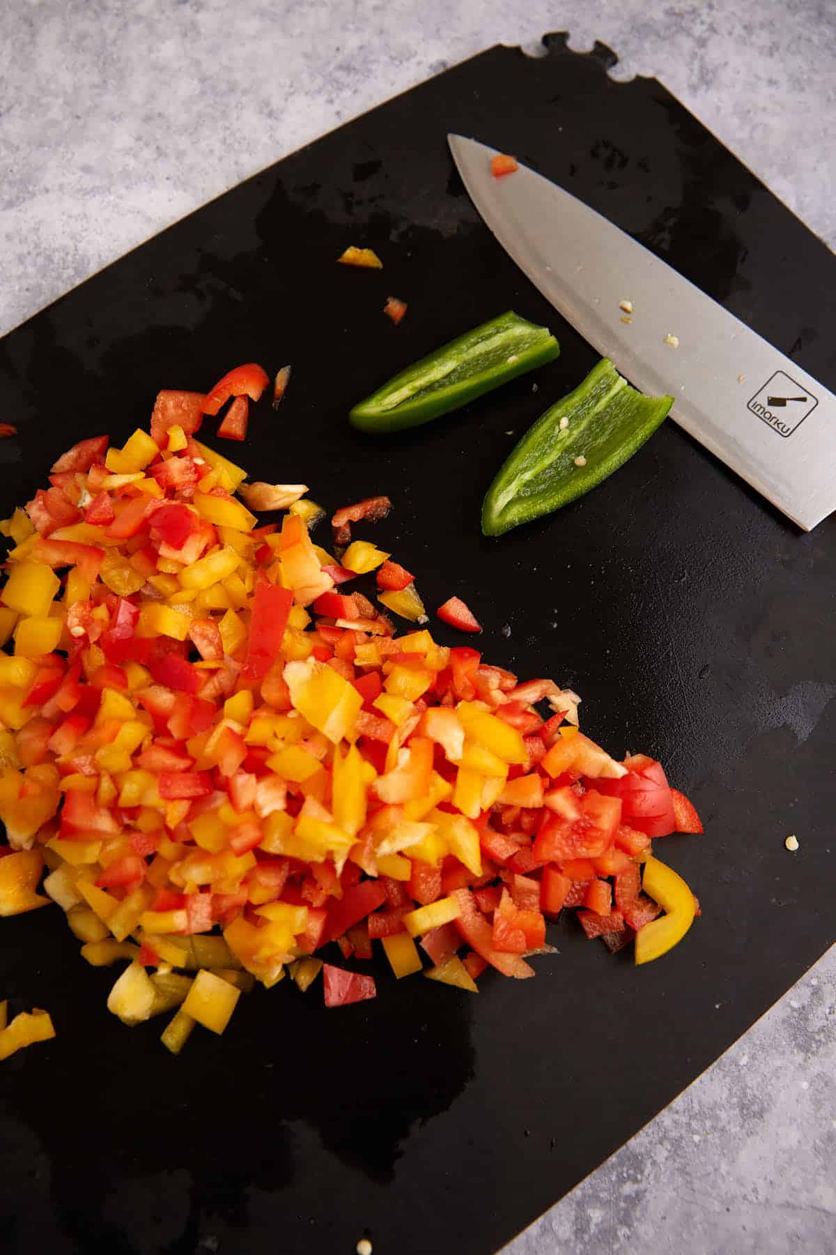 Chopped peppers on a cutting board.