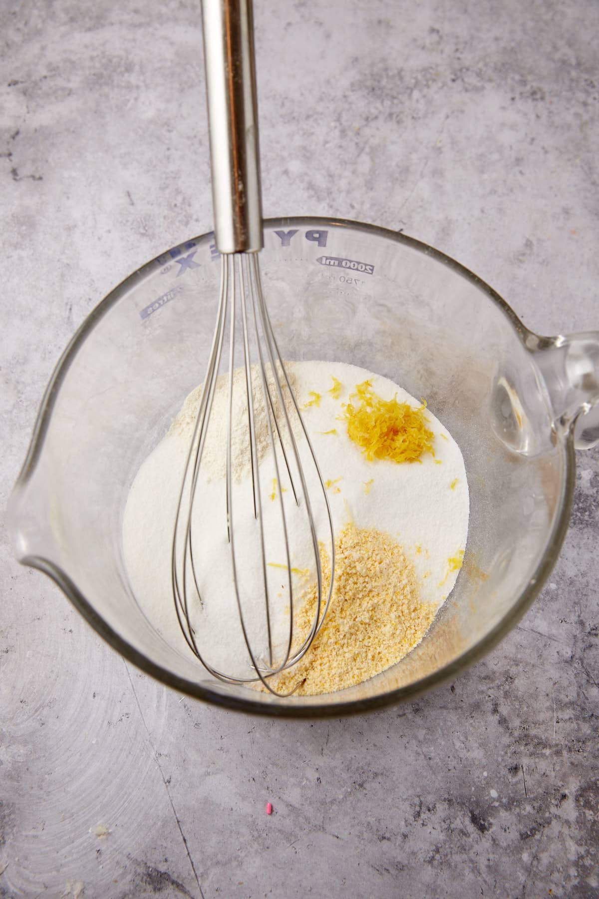 The dry ingredients in a bowl for a lemon chess pie.