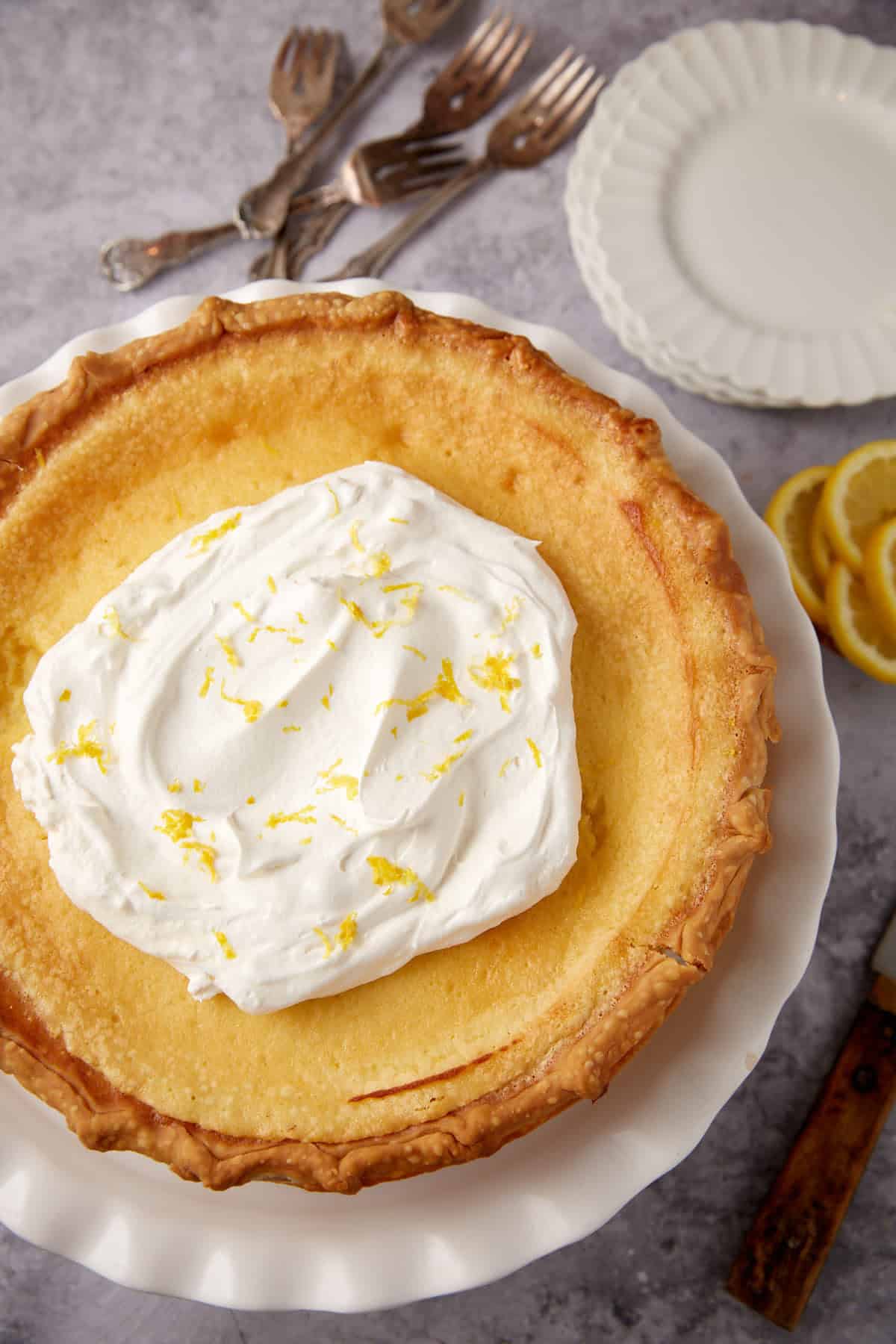Whipped cream topped lemon chess pie.