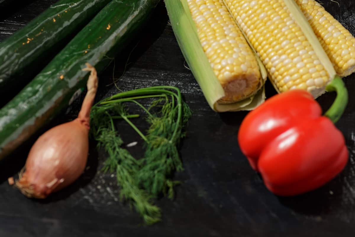 Ingredients for a corn and cucumber salad.